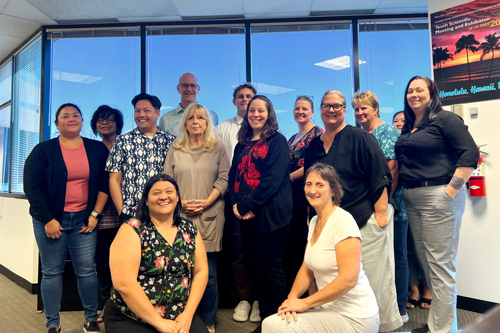 ISMRM office staff (with one person missing) with AMPC chair Brian Hargreaves.